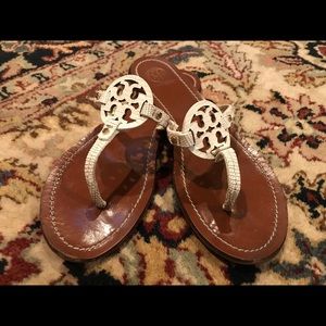White Tory Burch alligator skin thong sandals.